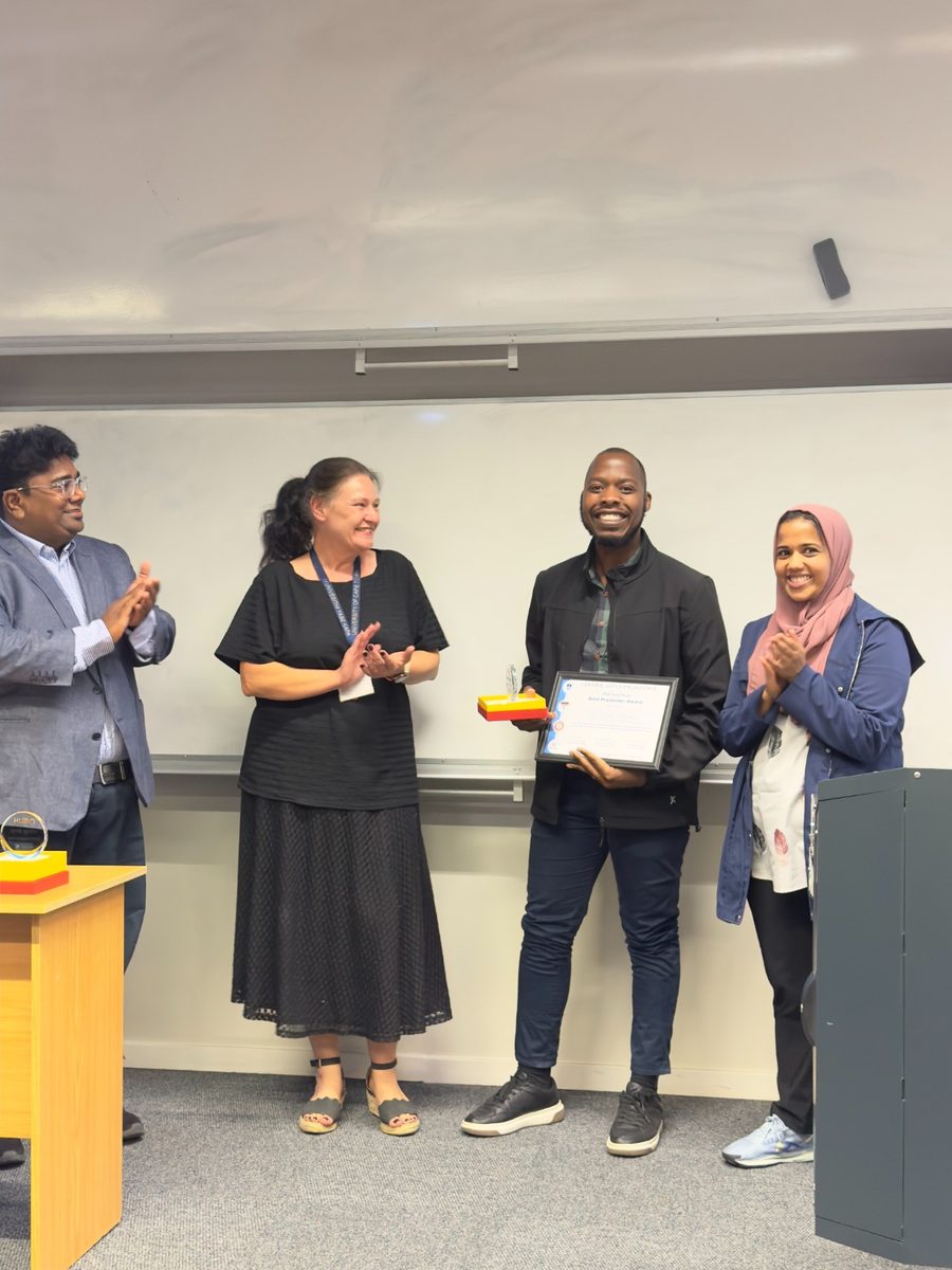 Prosper holding the certificate and trophy at the BME Ignite award ceremony