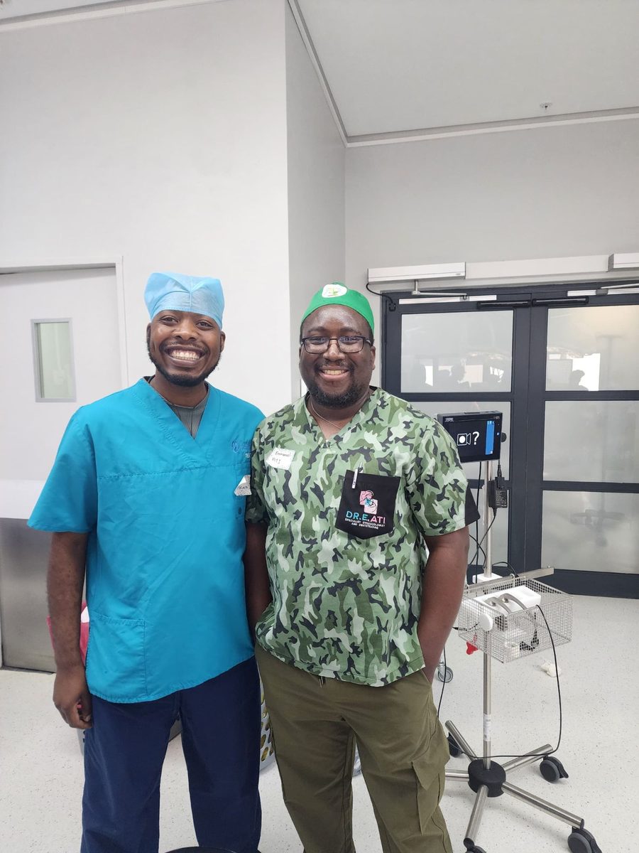 Prosper in scrubs with a surgeon in an operating theatre